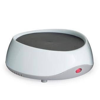Small round electronic device with a gray top and white base on a white background