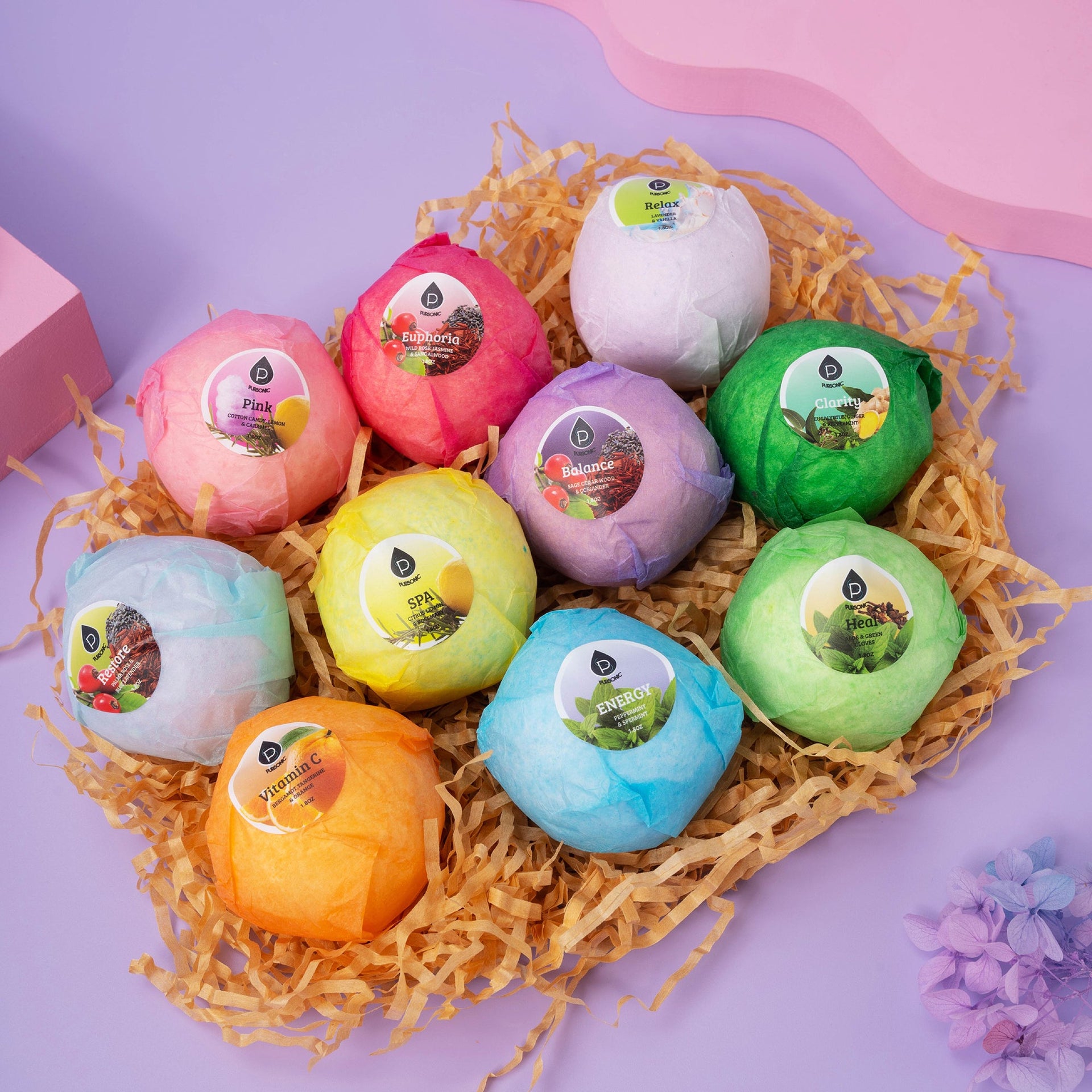 Colorful bath bombs in a decorative nest on a purple background