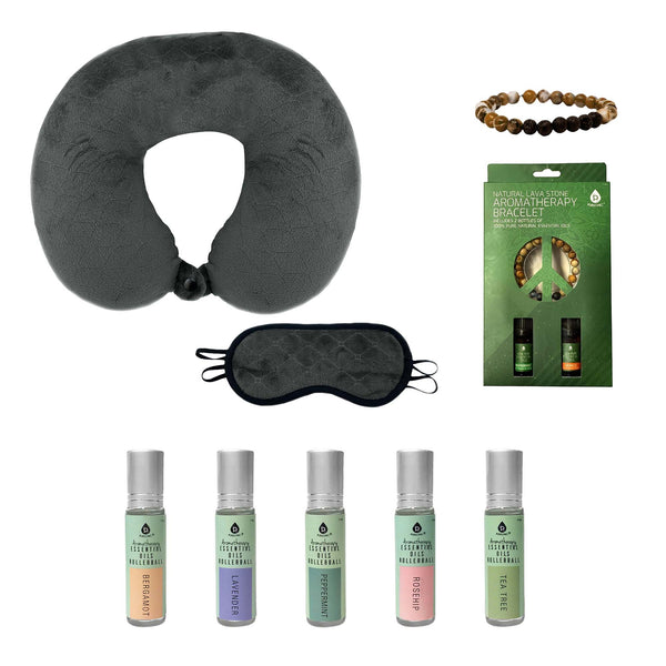 Collection of travel items including a neck pillow, eye mask, and essential oil bottles on a white background.