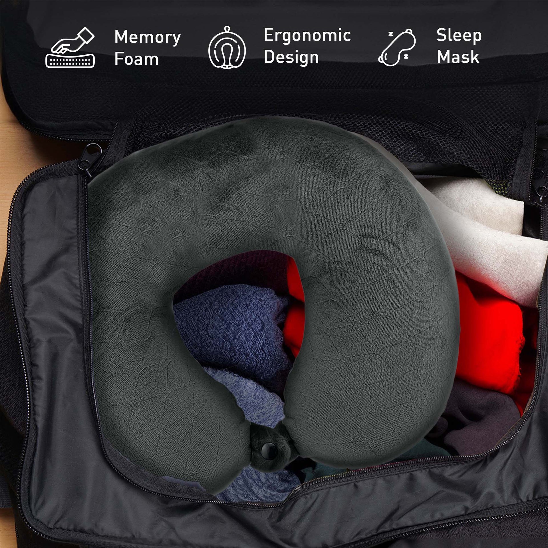 Gray travel neck pillow in an open suitcase with packing cubes, labeled with features like memory foam and ergonomic design.