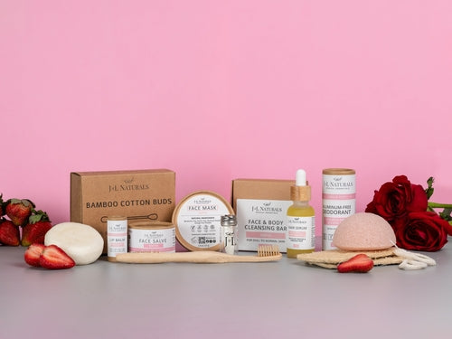 J&L naturals deluxe self care set soaps, toothbrush, shampoo bar, deoderant, cotton swabs, kojnac sponge, face mask