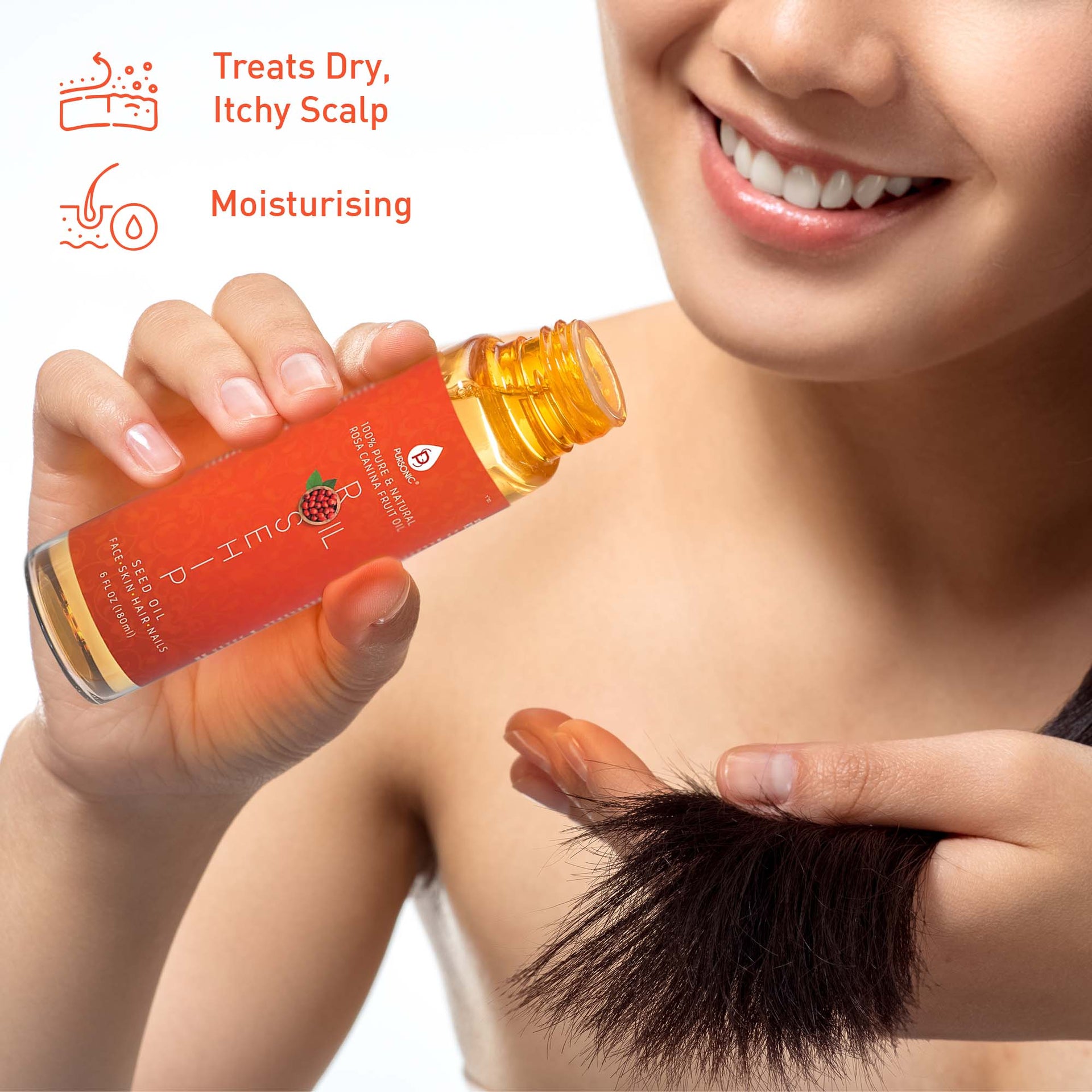 Person holding a bottle of hair care product with text indicating benefits on a plain background