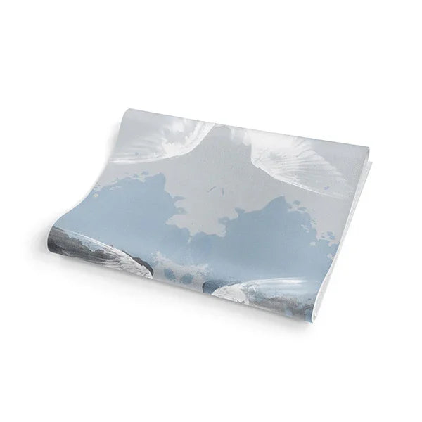 Product packaging with mountain and cloud design on a white background