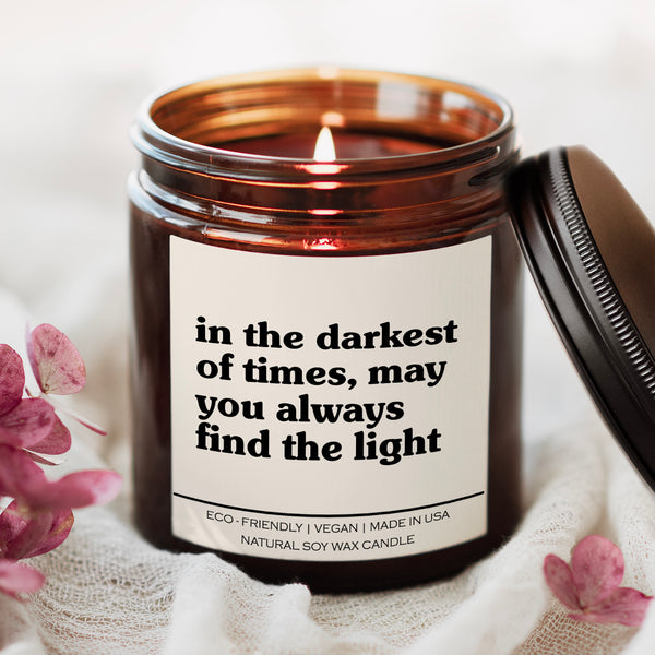 In The Darkest Of Times May You Always Find The Light candle in amber glass jar with white label, inspirational soy candle for lung warriors, caregivers, and healthcare self care