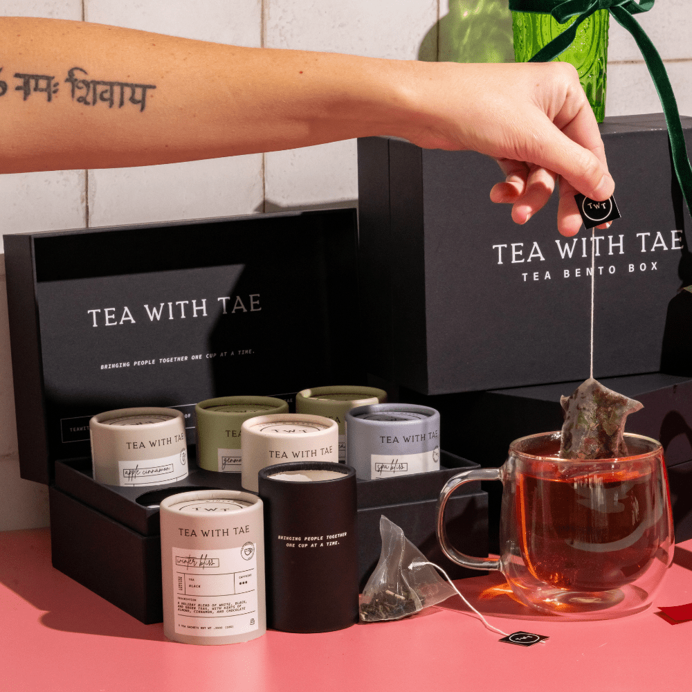 Healthcare worker enjoying a cup of tea from the Holiday Tea Bento Box for mindful post-shift relaxation