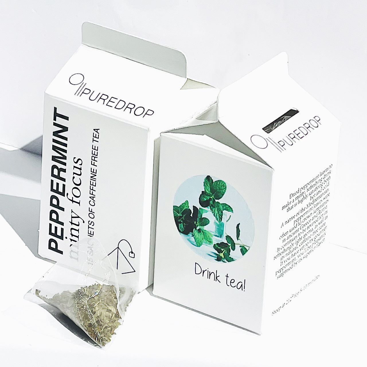 two boxes of minty focus peppermint tea with a sachet of tea in front of the boxes