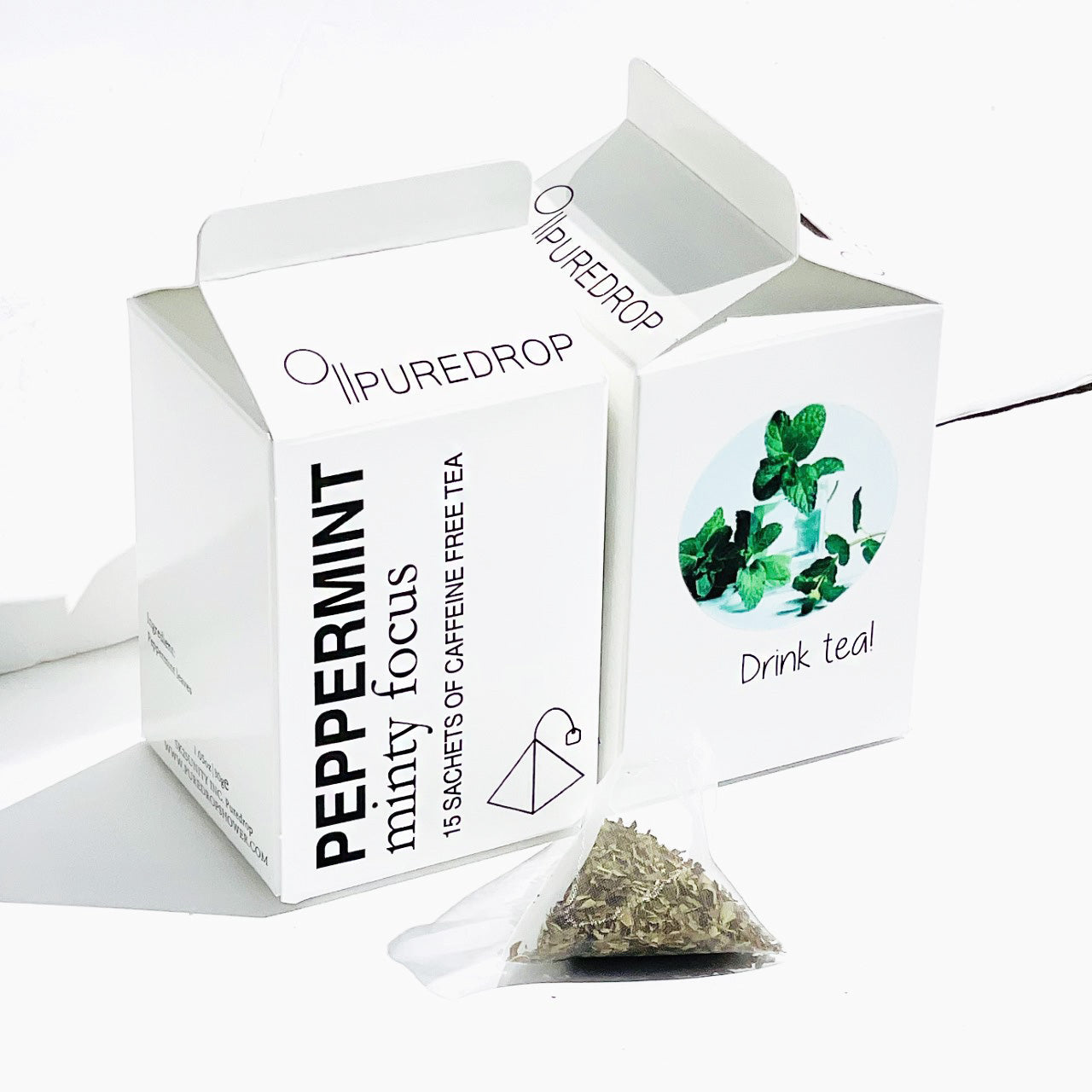 two boxes of minty focus peppermint tea with a sachet of tea in front of the boxes