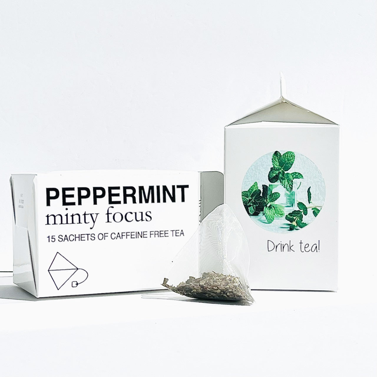 two boxes of minty focus peppermint tea with a sachet of tea in front of the boxes